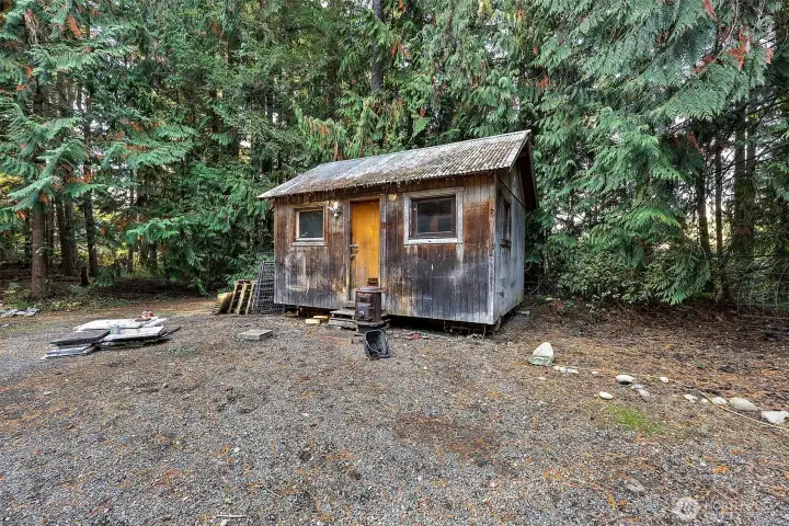 Playhouse, studio, she shed?  Has potential for power and wood stove can be replaced if desired