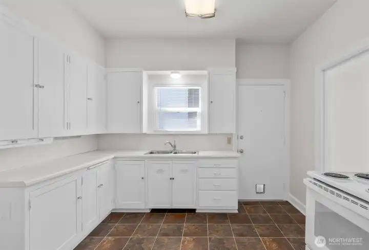 The upper-level kitchen has been freshly painted.