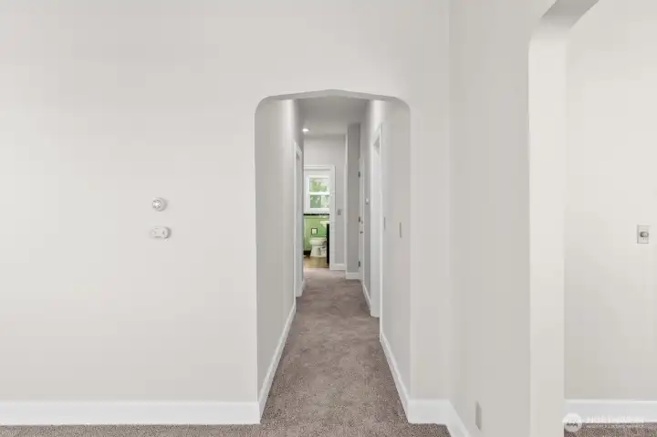 Upper-level looking down the hallway toward bathroom.