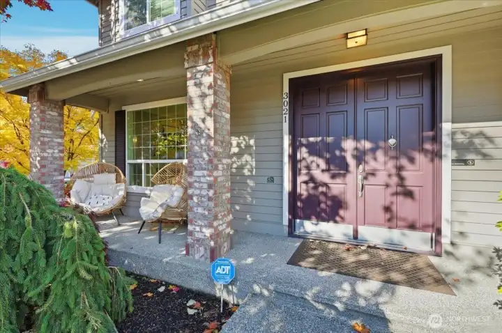 Enjoy this full length, covered front porch year round!  Canned lighting in the soffits!