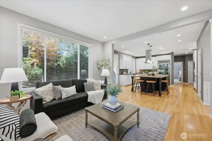 2nd living room space, The Great Room, just off kitchen, offers a wonderful, functional gathering place.  Enjoy deep, built-in book cases, hardwoods, Extra large window overlooking back yard oasis!