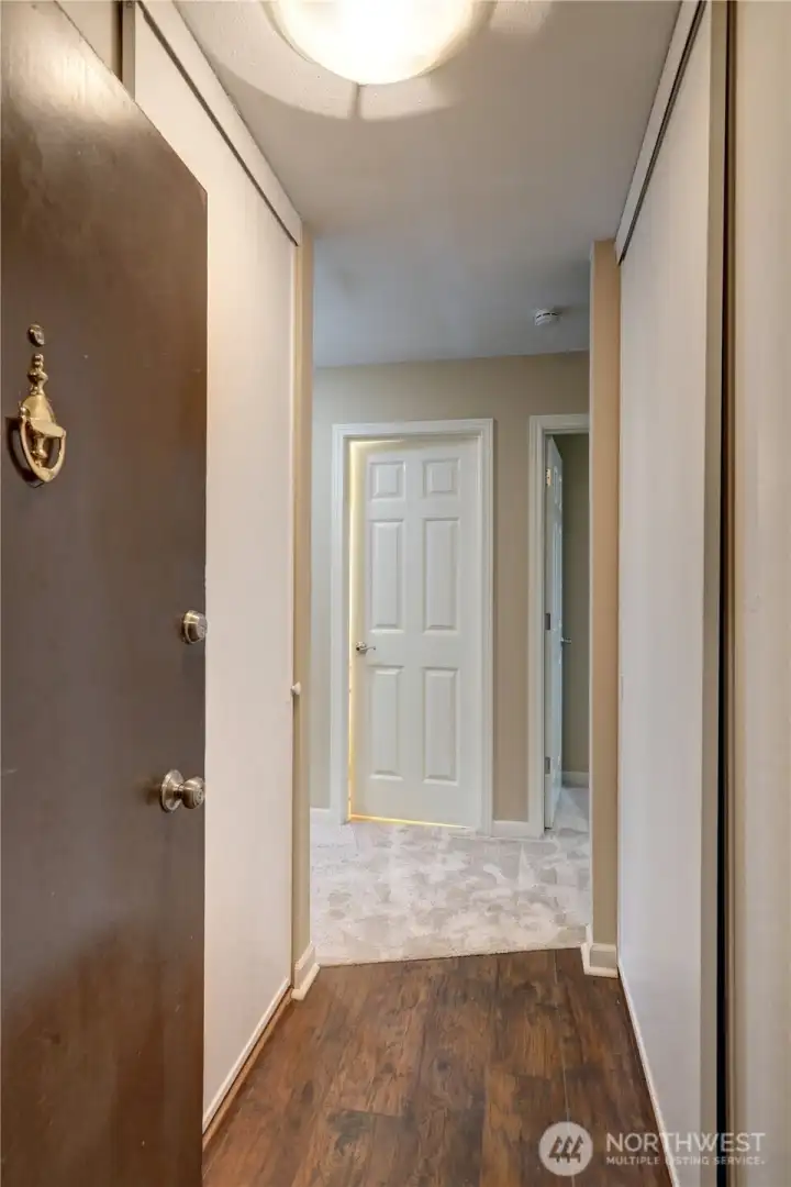 Condo entry w/ double door closets for storage