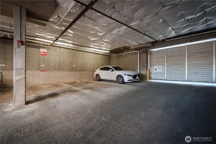 Space #49, just inside the garage door and across from door leading to unit
