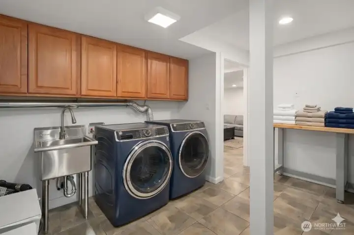 Great laundry area, laundry sink, and folding area.