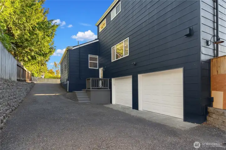Large 2 car garage with side driveway could accommodate many cars, an RV, or boat.