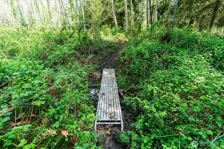 A second creek on the property enables unique landscaping and cozy seating areas by the waters edge