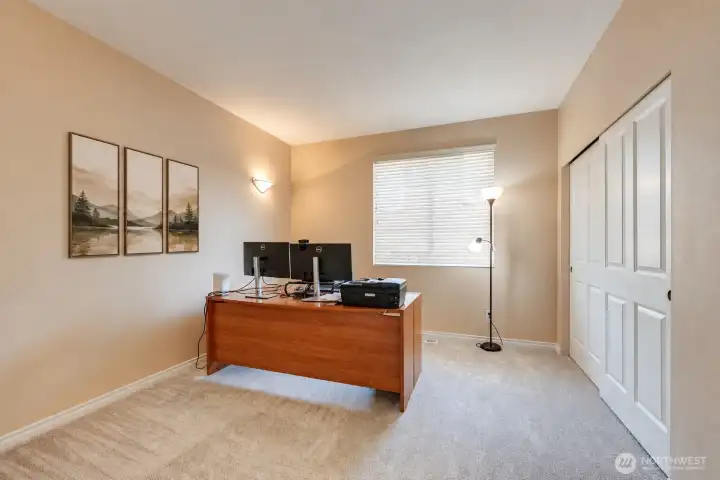 Main floor bedroom with an adjacent 3/4 bathroom.