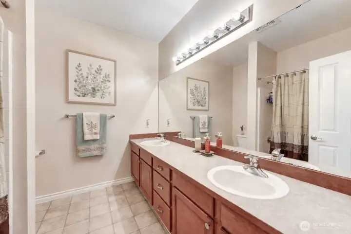 Guest bathroom with double sinks.