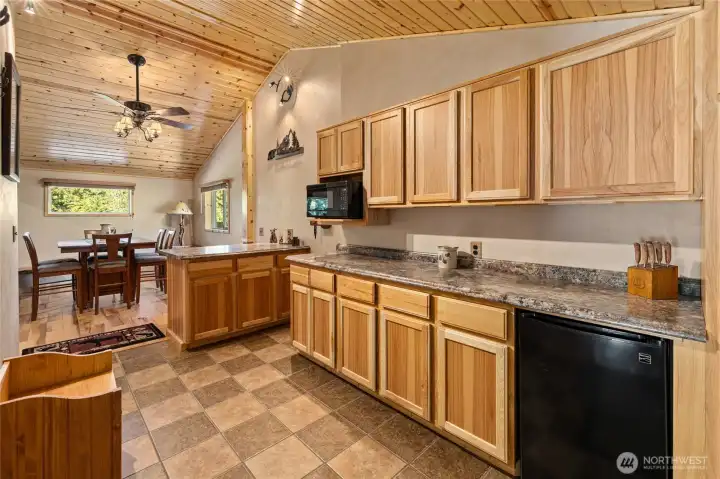 The kitchenette area with mini fridge and microwave.
