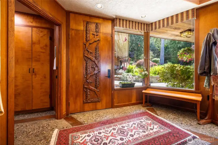 11 foot entry features a monumental, solid-wood front door hand-carved with an intricate Alaskan motif by renowned local artist A. Hipusch. 11 foot entry features a monumental, solid-wood front door hand-carved with an intricate Alaskan motif by renowned local artist A. Hipusch.