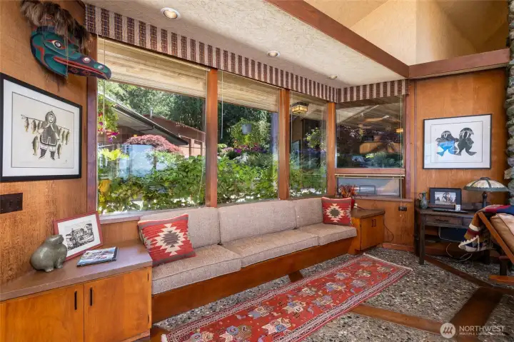 Expansive windows framing the estate's park-like grounds. Expansive windows framing the estate's park-like grounds.