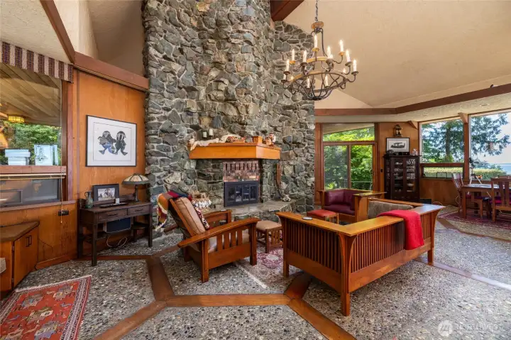 A massive, 30-foot double-sided fireplace anchors the grand living space, crafted from 36 tons of hand-mined Fidalgo Island rock. A massive, 30-foot double-sided fireplace anchors the grand living space, crafted from 36 tons of hand-mined Fidalgo Island rock.