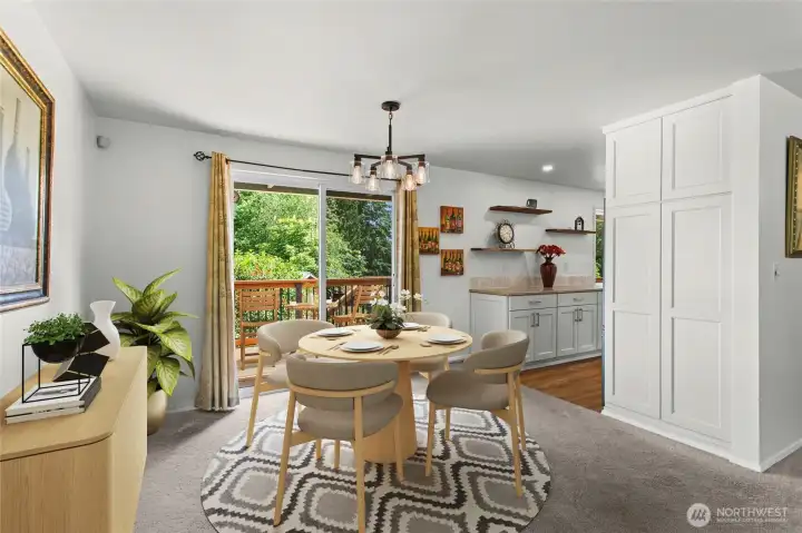 *Photo digitally staged* Dining area opens to spacious deck perfect for entertaining.