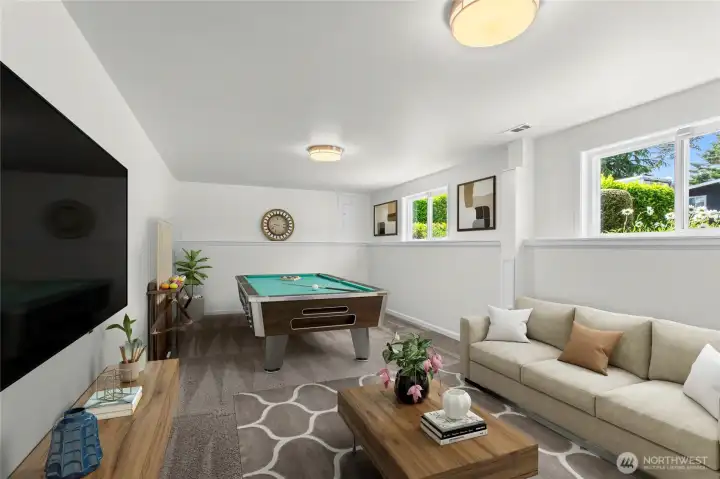 *Photo digitally staged* Huge flexible room down stairs - can be 2nd living room; entertainment room