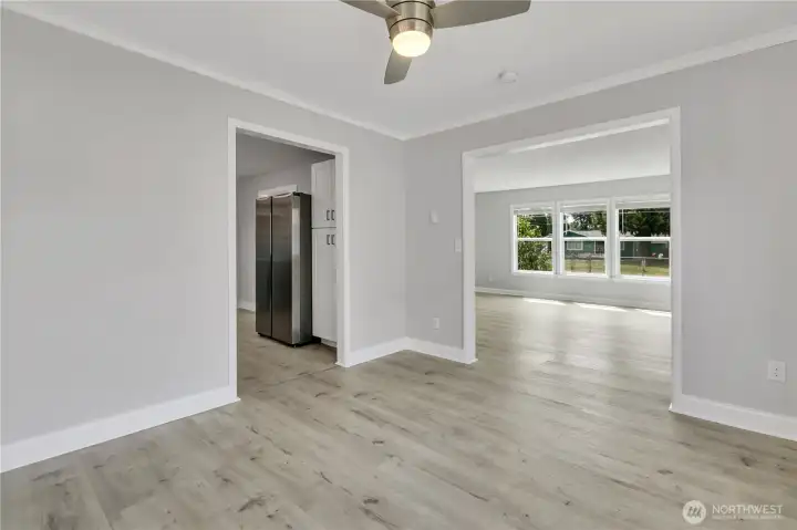 The dining area connects with both the kitchen and the living room for easy gatherings.
