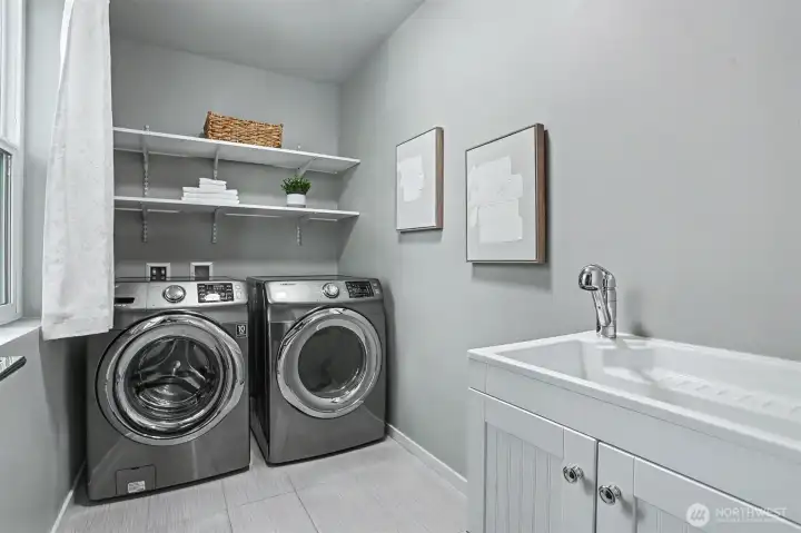 Full laundry room at the top of the stairs. Full laundry room at the top of the stairs.