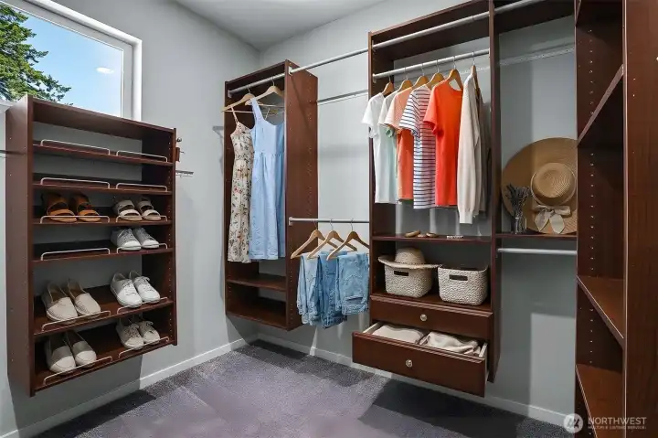 Walk-in closet in Primary Bedroom. Closet is virtually staged. Walk-in closet in Primary Bedroom. Closet is virtually staged.