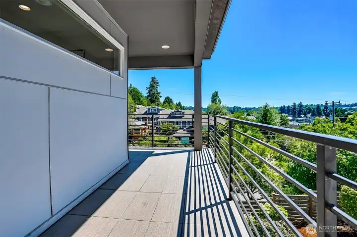 West-facing portion of the wraparound balcony off Primary Bedroom. West-facing portion of the wraparound balcony off Primary Bedroom.