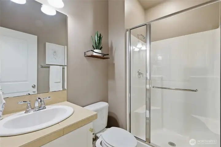 3/4 bathroom with shower on main floor.