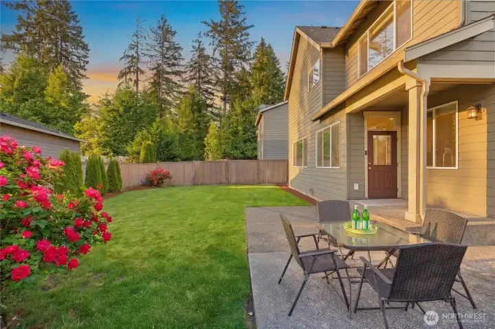 Expanded patio and newer privacy trees will continue to grow!