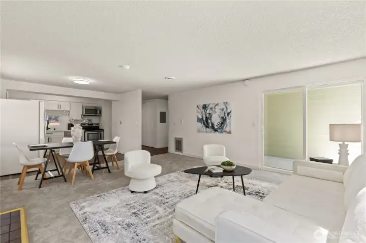 Living rm + fireplace + Large Windows for natural light + Partially covered Deck through double glass sliders
