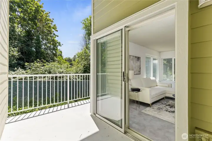 Large Windows for natural light + Partially covered Deck through double glass sliders