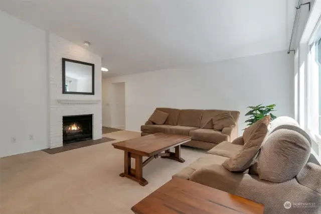 Main floor living room with gas fireplace.