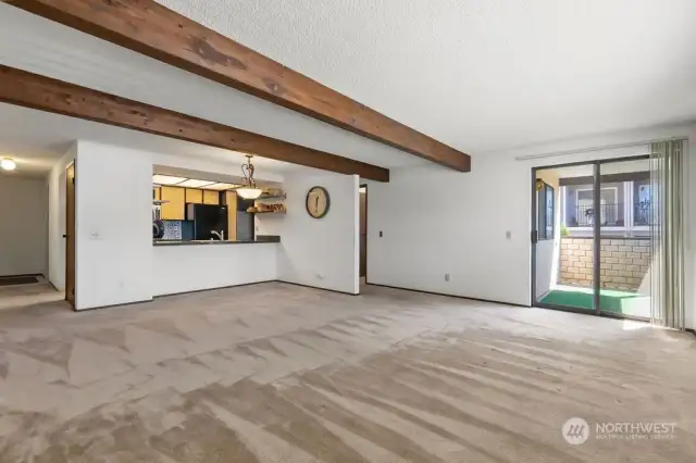 living and dining room looking towards the kitchen. Balcony slider also