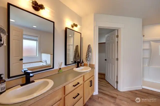 Primary suite with full bath, jetted tub, walk in shower and walk in closet.