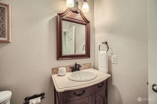 Powder room off lower- level family room.