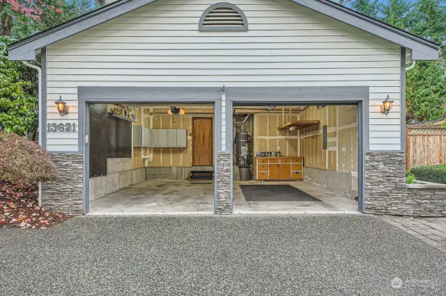 2 Car garage with vaulted rafters and work bench.