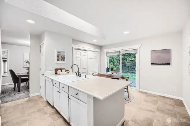 Sweet kitchen with 2 pantries, breakfast bar and huge skylight. Slider to BBQ patio.