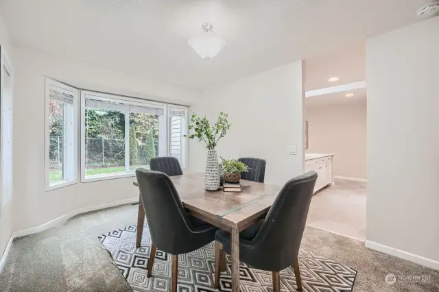 Formal dining room can comfortably seat up to 8.