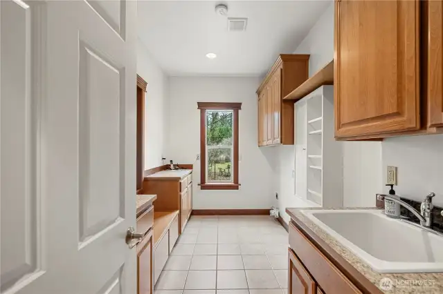 Mudroom/Laundry Room with utility sink and tons of storage space.