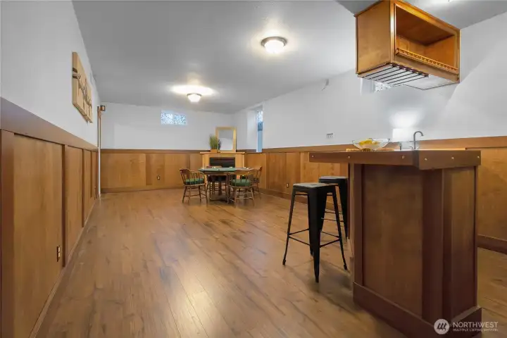 Downstairs Game room or extra family room with bar area and fireplace.