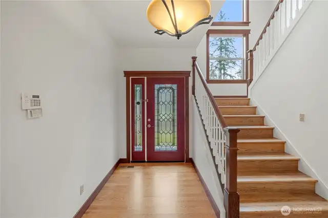 Entry is warm and inviting with hardwood floors - recently buffed out.