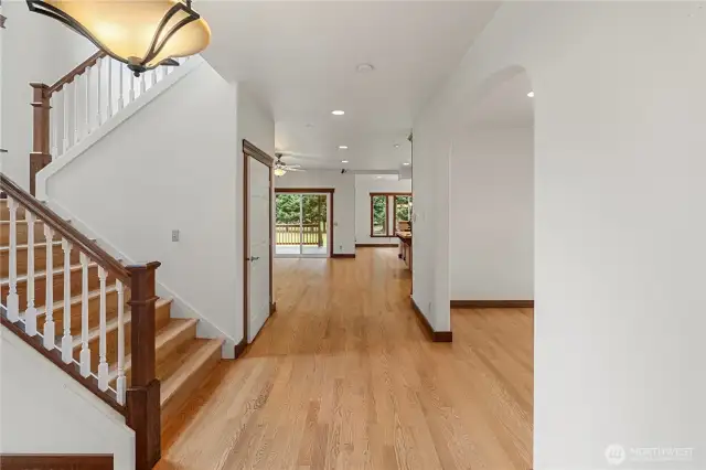 From the entry way you can head into formal dining room and open living room/kitchen.  The door to the left will take you downstairs to full basement.