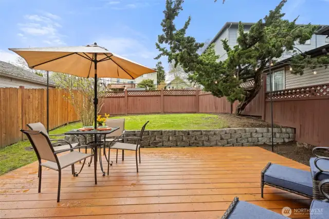 Spacious backyard with a gorgeous deck for relaxing and entertaining