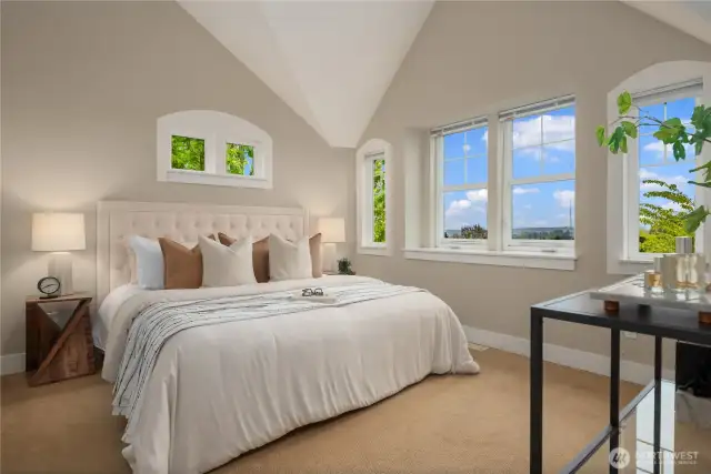 The upper floor features two large bedrooms, both with en suites and both with dramatic vaulted ceilings. The views are something special as well!