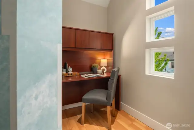 A separate office off the primary suite is a hidden gem with custom artisan paint.