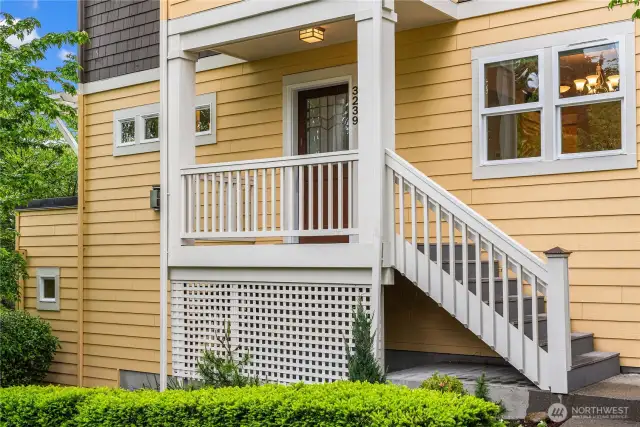 The formal covered entry leads up to the main living area. You can also enter through the 2 car garage on the lower level.
