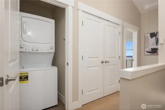 On the top floor is the laundry and double-door storage right next to the appliances.
