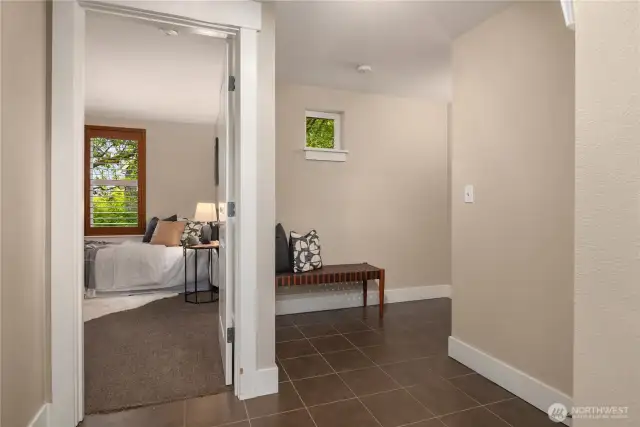 On the lower level is a large tiled entry off the garage as well as the third bedroom.