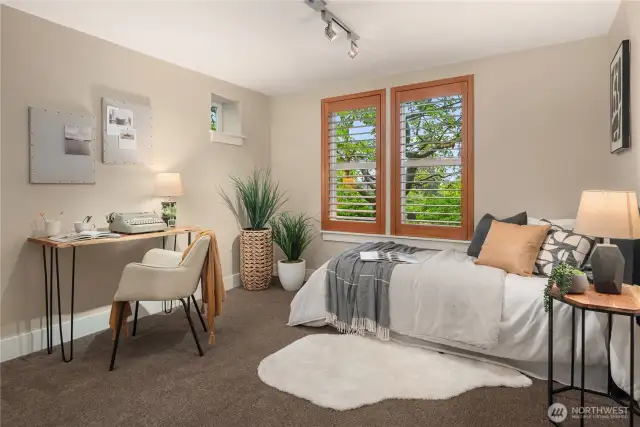 The third bedroom features plantation shutters and a private bathroom.