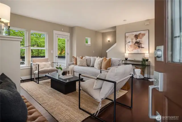 The formal entry opens up to this enormous living room with new paint and hardwood floors.
