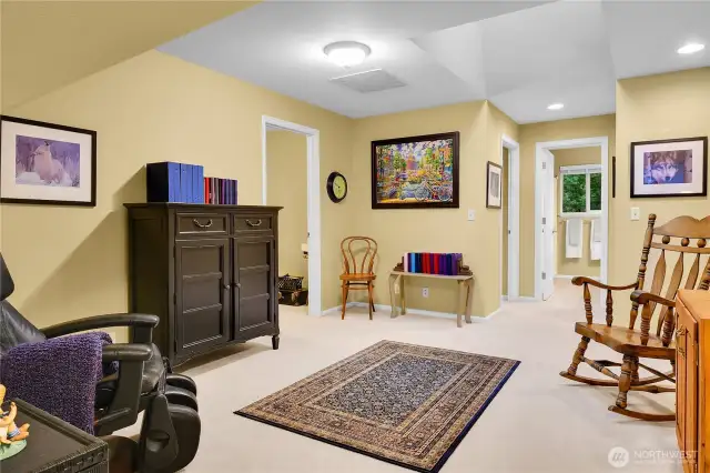 Upper level flex room with pony-wall overlook into the entry foyer, skylighted ceiling. Neutral carpet. Desk alcove with divided-light window and screen. Neutral carpet. Paneled Quaker door to additional office hideaway.