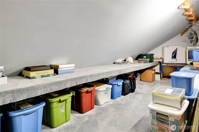 Huge, lighted, carpeted wraparound storage area.