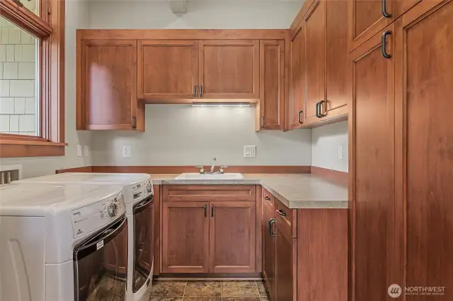 The laundry room is spacious with lots of storage.