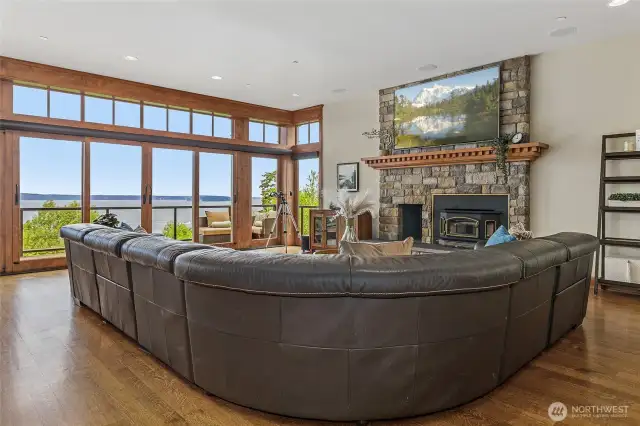 The main living room with a wood burning fireplace.