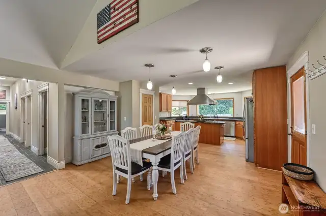Entryway, dining area with the kitchen beyond.